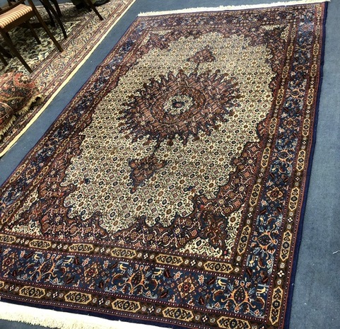 A Tabriz blue ground carpet 294 x 197cm